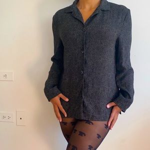 Mini black blazer can be worn as a dress.